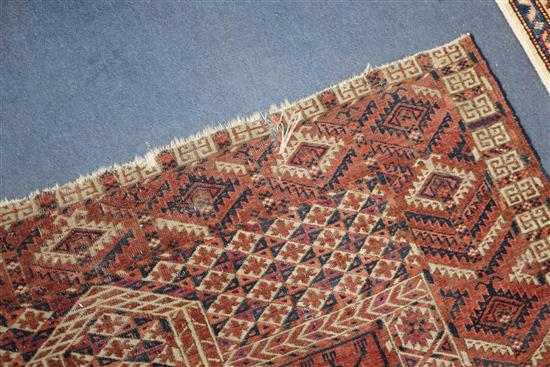 A Bokhara red ground rug 125 x 150cm